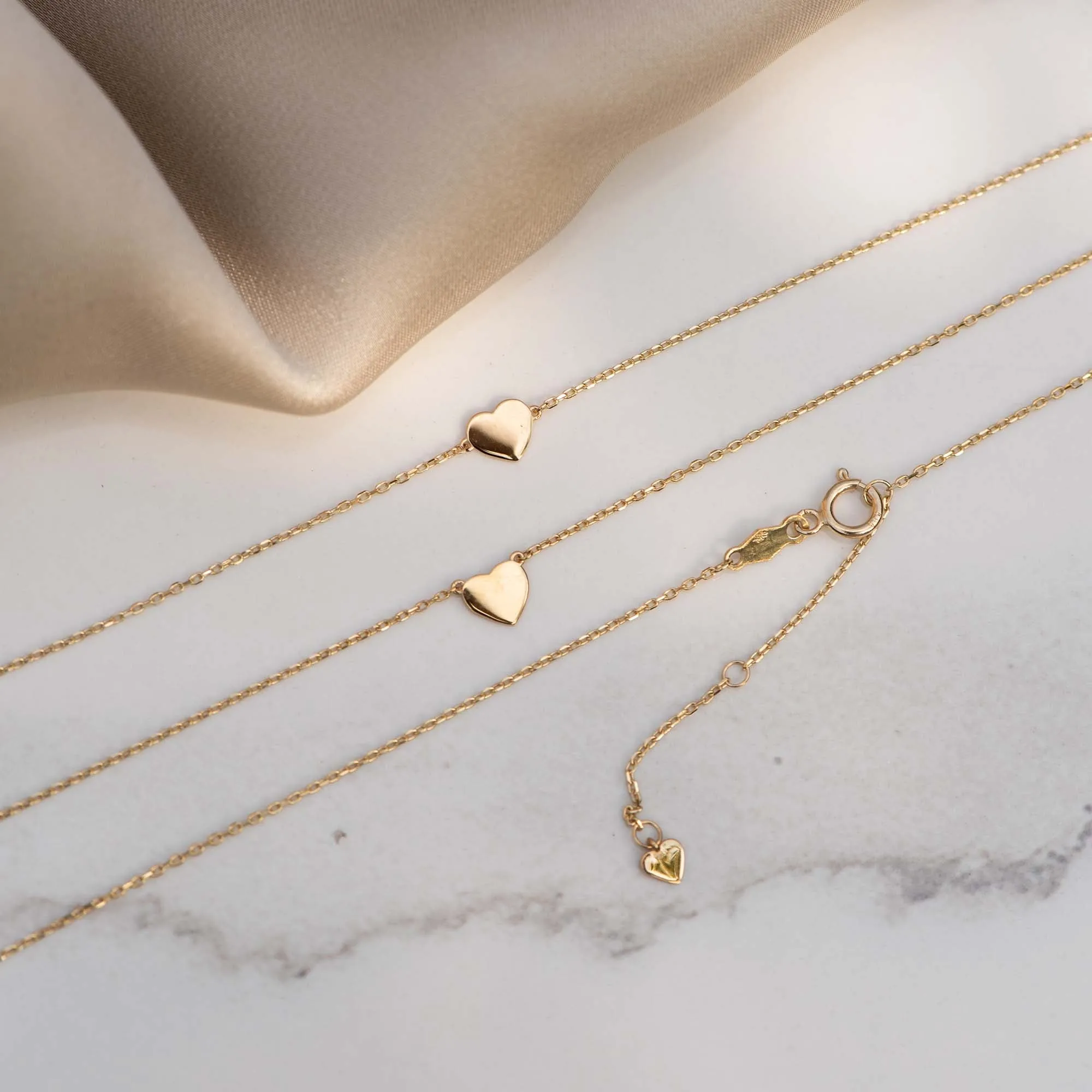 Cadeau d'Isabel 14 karat gold necklace and bracelet set with heart