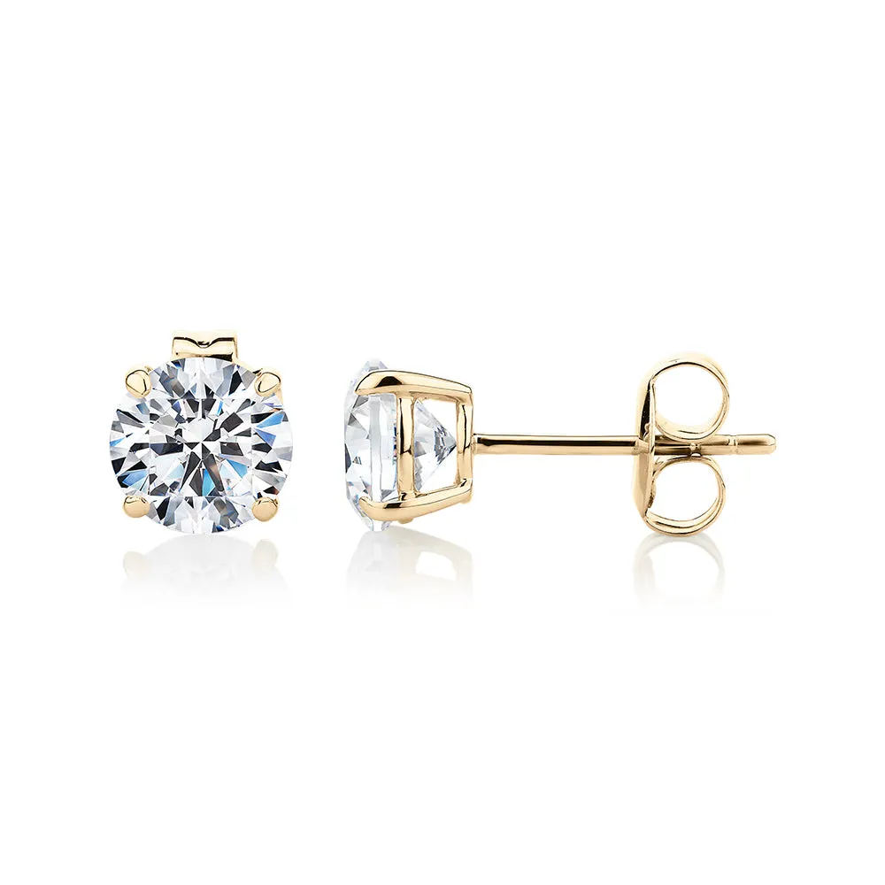 Round Brilliant stud earrings with 2 carats* of diamond simulants in 10 carat yellow gold